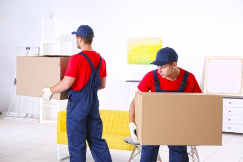 A local Man With Van Earlscourt team carefully loading items for transport