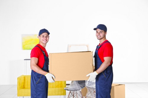 Loading furniture into a van on a residential Earlscourt street
