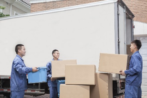 Careful loading of furniture into a moving van in Earlscourt