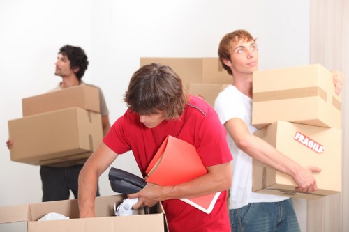 Moving van and packed boxes for a home move in Earlscourt